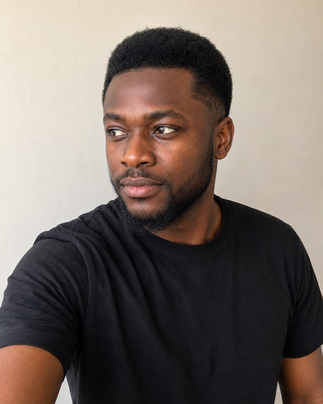Femi — writing at his desk